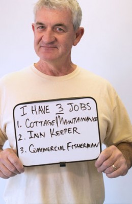 North Carolina coastal residents hold up dry-erase boards marking their profession, like this guys, on NotTheAnswerNC.org, the website of a coalition of environmental groups opposing offshore drilling. They maintain, "Oil jobs are estimates. Our jobs are real." Photo: Julie Dreelin, Daniel Pullen