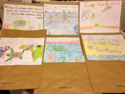 Students at Stokesdale Elementary School in Stokes County drew these pictures on grocery store bags, which will be distributed to shoppers in the area to raise awareness for sea turtles. The kids also donated their allowance, ice cream money and pocket change – more than $200 – to NEST. Photo: NEST 