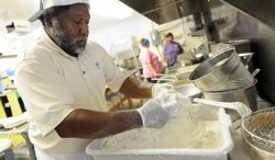 Andy Gaus works in the kitchen at Calabash Seafood Hut. Photo: Allison Ballard