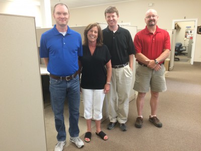 Fowler, second from left, poses with her staff, Shannon Jenkins, Andrew Haines and J.D. Potts. Photo: Mark Hibbs