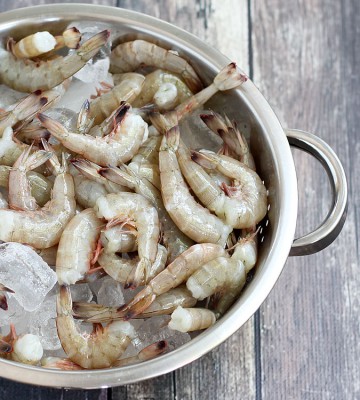 Fresh shrimp are recognized by having firm bodies that are still attached to their shell. You should always avoid shrimp with any sign of odor or pink color. Photo: Amy Brinkley