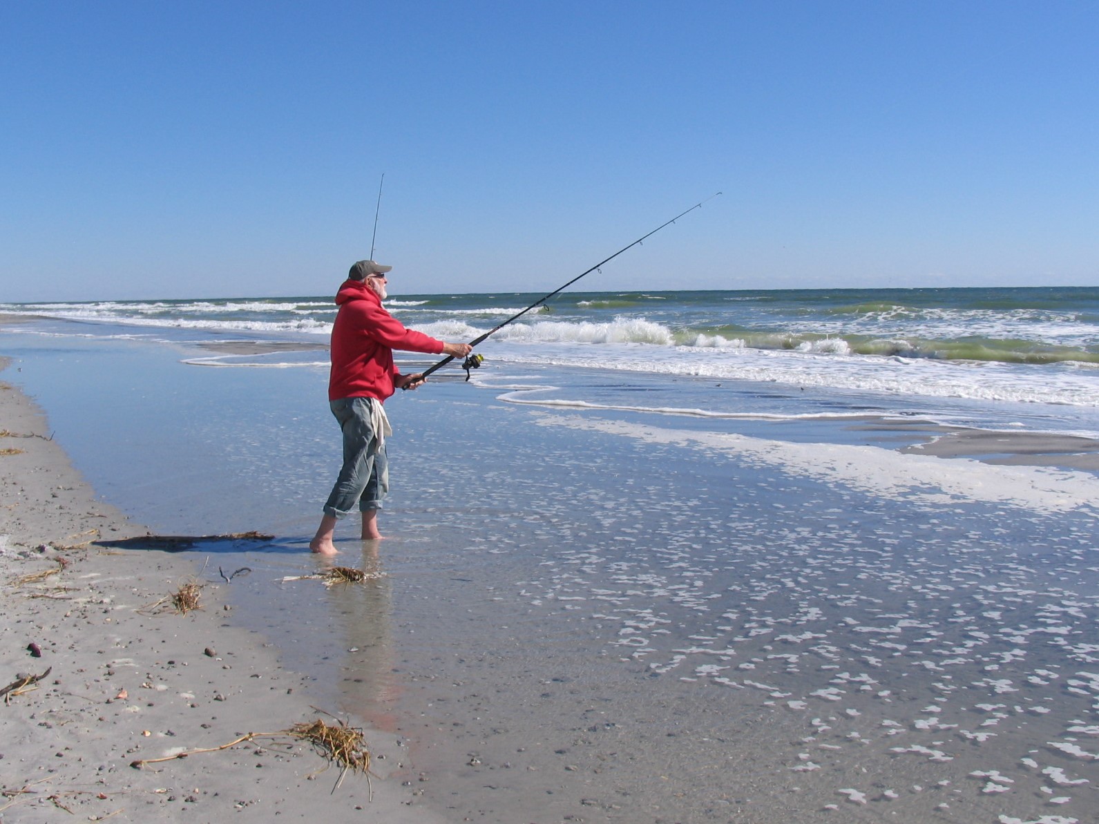 Don Roberts of Stow, Ohio, casts into the surf. File photo: Mark Hibbs