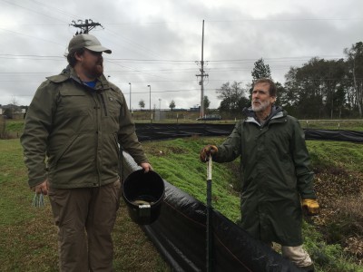 Carson and Andy Wood discuss the fencing at the pond site. Photo: Lexia Weaver