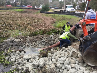 Water is pumped Thursday from the ponds just off N.C. 24 in Cape Carteret. Photo: Lexia Weaver