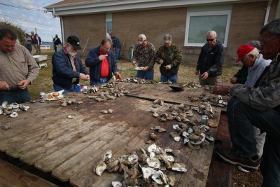 Around the crowded table it was silent, except for the scraping of oyster knives. Photo: Sam Bland 