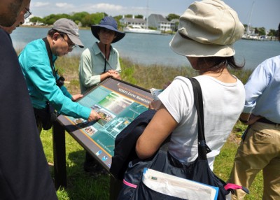 A group from the Japan Ecosystem Conservation Society explores the National Oceanic and Atmospheric Administration’s Beaufort lab during a visit to the area last week. Photo: Todd Miller