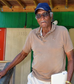 Louis “Bobby” Brown, 85, of Navassa, heads out the door at the Countywide Community Development Corp. office in town on his way to a meeting Friday. He worked at the Kerr-McGee site for about three years as a young man. Photo: Mark Hibbs