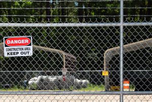 Signs at the former Kerr-McGee Chemical Corp. site warn people to keep out. The site has been unused since creosote operations ceased in the 1970s. Photo: Mark Hibbs