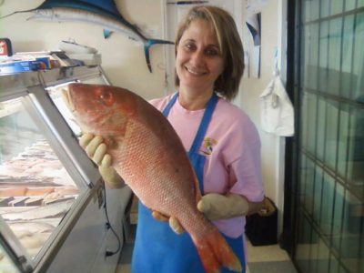 Jeanne-Darc Wehbe shows off the fare at Pelican Seafood. Photo: Liz Biro