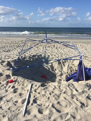 Holes and debris left behind can trap and injure turtles as they attempt to make their way to shore. Lamping encourages beachgoers to remove their items and fill holes. Photo by Ashita Gona. 