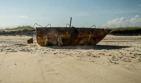 The Coast Guard interdicted the rusted boat off South Florida. The passengers were removed and the boat set adrift. It washed ashore at Cape Lookout National Seashore. Photo: Joanie Alexander