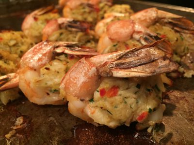 Bake the stuffed shrimp uncovered in the preheated oven at 375 degrees for about 15 minutes, until the shrimp are pink and the crab meat is heated through. Alternately, cook the stuffed shrimp on a fine-mesh or foil-lined grate on a hot, covered grill. Photo: Liz Biro