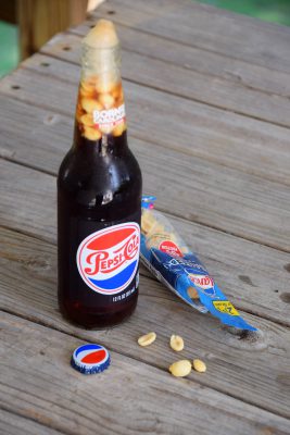 A handful of salted, roasted peanuts poured into a bottle of Pepsi makes for a flavor combination that may not appeal to everyone. Photo: Mark Hibbs