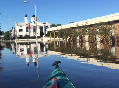 Floodwaters reflect the Bertie County Courthouse in Windsor, and at right is the library, flooded again for the second time in a month. Contributed Photo by Scott Sauer