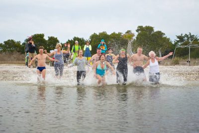 Polar Plunge participants brave the chilly waters off Pelican Island. Photo: Second Wind Yoga and Eco-Tours