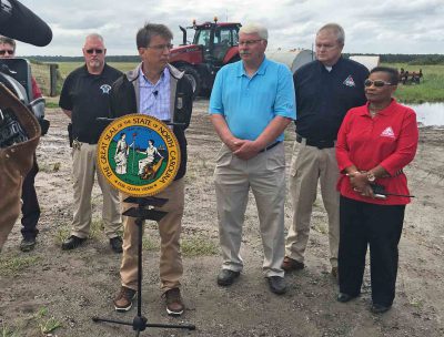 Gov. Pat McCrory and Agriculture Commissioner Steve Troxler speak during a visit to Washington and Tyrrell counties in September. Photo: Governor’s office