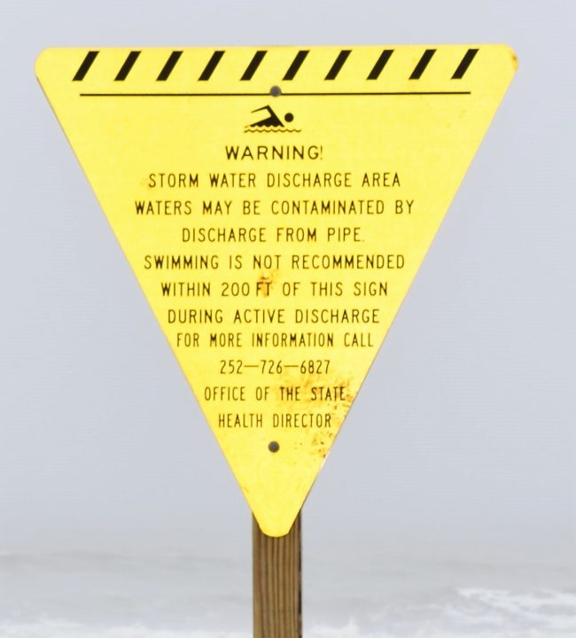 Advisory signs warn that swimming is not recommended within 200 feet of the sign. 