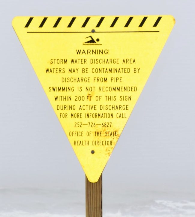 Advisories warn that swimming is not recommended within 200 feet of the sign. 