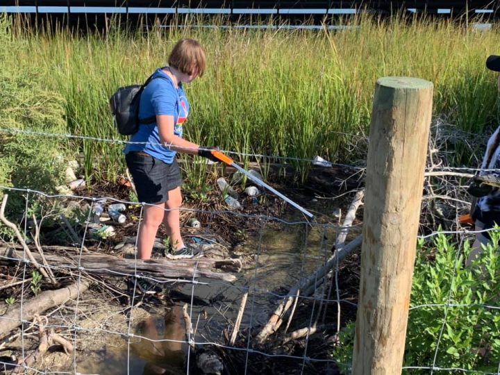 A student volunteers during a recent cleanup of Radio Island. Photo: Carteret Big Sweep