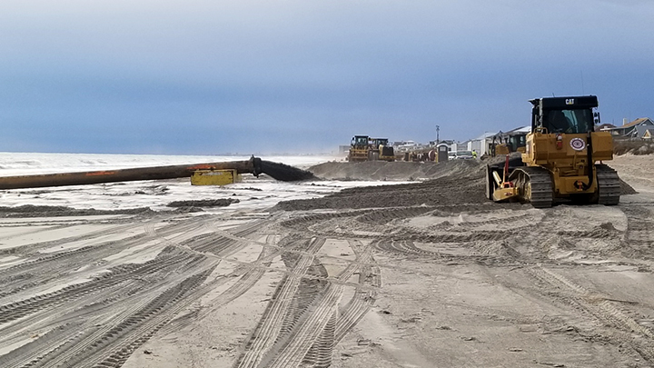 Sand is pumped onto the beach in Atlantic Beach during a past Bogue Banks renourishment project. Photo: Carteret County Shore Protection