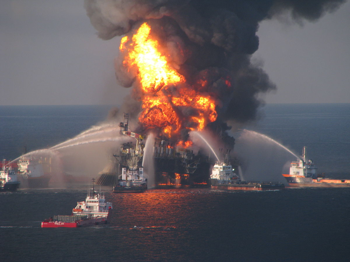 Fire boat response crews battle the blazing remnants of the offshore oil rig Deepwater Horizon. A Coast Guard MH-65C dolphin rescue helicopter and crew document the fire while searching for survivors. Multiple Coast Guard helicopters, planes and cutters responded to rescue the Deepwater Horizon's 126-person crew. Photo: U.S. Coast Guard