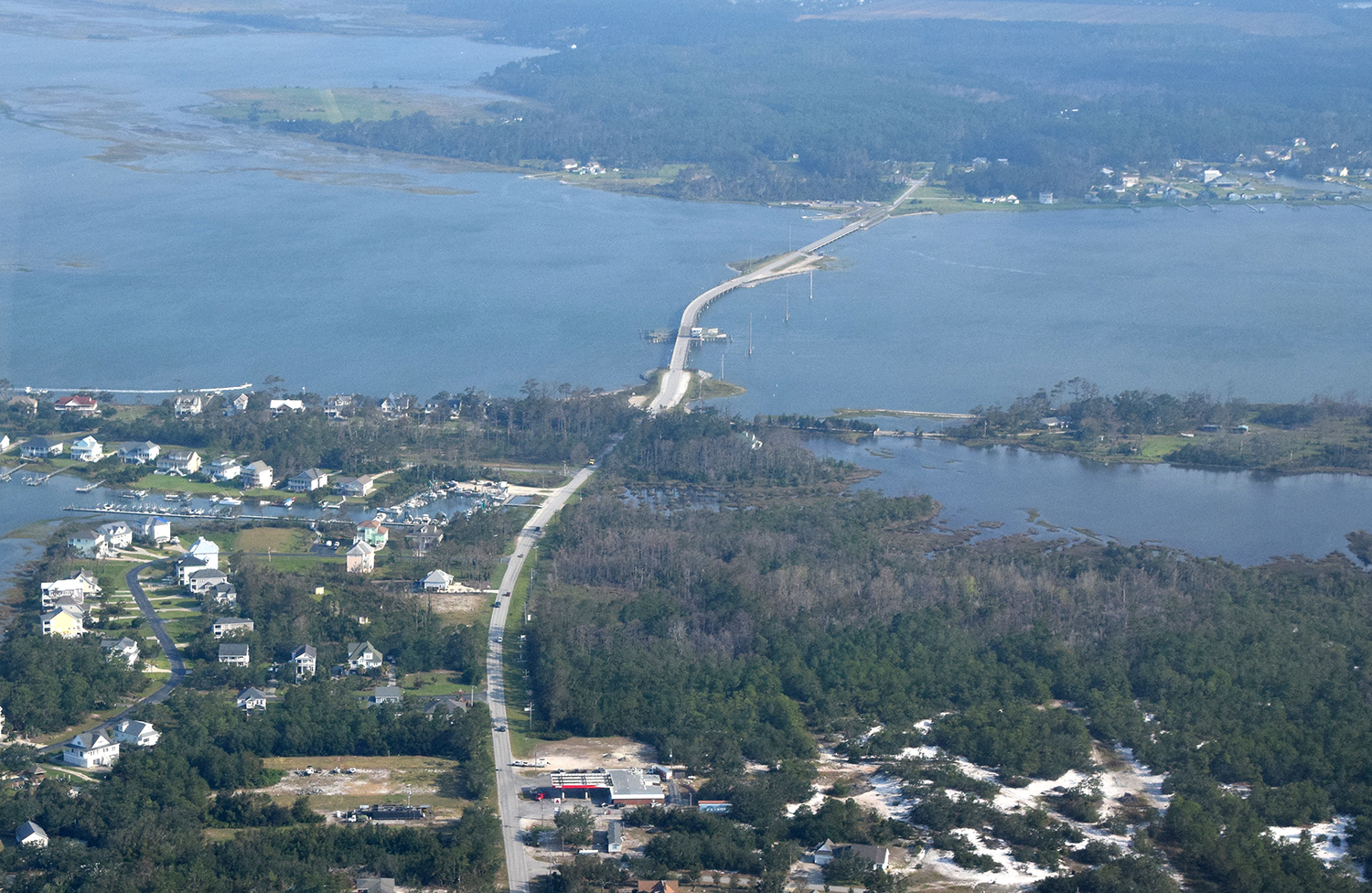 The North Carolina Department of Transportation has awarded contracts to replace the swing-span Earl C. Davis Memorial Bridge and Bridge No. 96, both of which connect the Straits township shown at top to Harkers Island. Photo: Mark Hibbs 