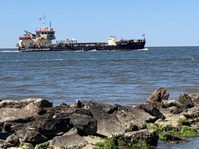 A dredge transits the ferry channel just outside of Ocracoke’s Silver Lake Harbor in 2021. Photo: Mark Hibbs