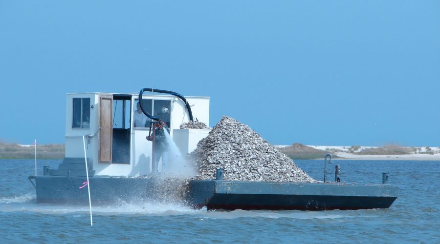 Crews work to deploy oyster shell. Photo: North Carolina Coastal Federation