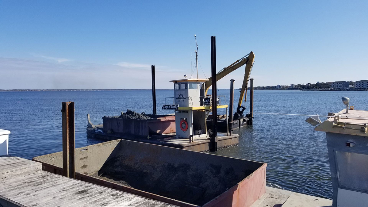 A private dredge operation is shown underway in 2019 at a Carteret County marina. Photo: Carteret County Shore Protection Office