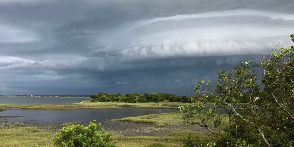 A storm cloud hovers over Harkers Island in this undated National Weather Service photo. Photo: Chuck Laughridge/NWS