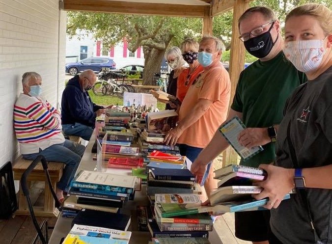 BOOKWORM: Volunteers help at the N.C. Maritime Museum’s book sale, which raises funds to purchase maritime-related books for the museum library.  Photo: N.C. Maritime Museums
