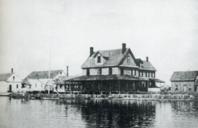 The Doxsee clam factory, Ocracoke, N.C., early 1900s. Originally based in Islip, N.Y., the Doxsee family relocated its main operation to Ocracoke in 1897-98. According to Ocracoke historian Phillip Howard, “most of the island’s young, unmarried women, as well as several widows, worked at Doxsee’s picking clams.” Local watermen such as “Big Ike” O’Neal supplied the factory with clams. Photo courtesy of Phillip’s wonderful Village Craftsmen blog and the Doxsee family.

