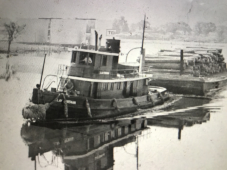 The tug Clay Foreman carrying a barge load of logs to the Foreman-Blades Lumber Mill in Elizabeth City, N.C. Courtesy, Museum of the Albemarle 