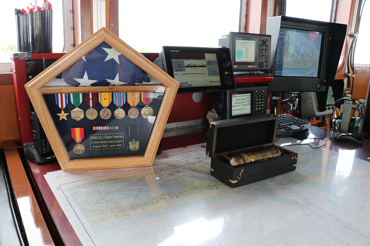 Chief Petty Officer Glen Harris' service medals and spyglass are displayed on the bridge of the Coast Guard cutter that bears his name. Photo: Ann Cary Simpson