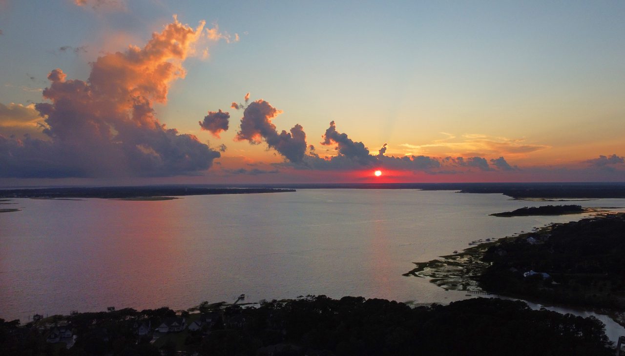 The sun sets over the Newport River in between Beaufort and Morehead City in Carteret County. Photo: Dylan Ray