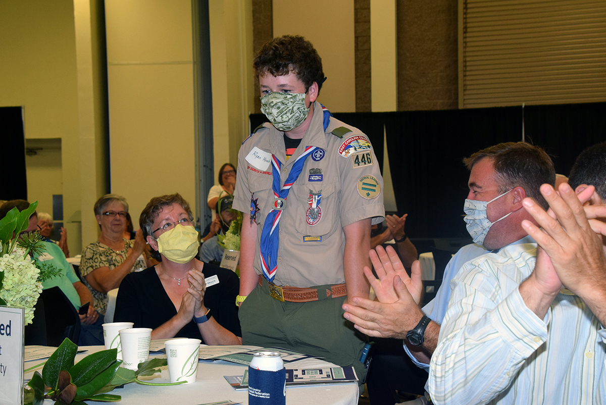 Scout Ryan Mrock of Troop 446 of Cape Carteret reacts in surprise he is announced winner of a special Junior Pelican Award during the North Carolina Coastal Federation's annual recognition of coastal stewardship Saturday at the Crystal Coast Civic Center in Morehead City. Photo: Mark Hibbs