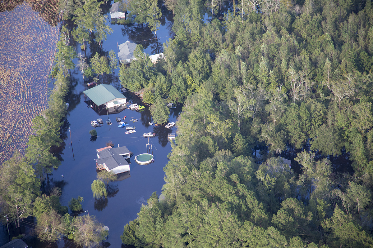 Homes and businesses are surrounded by water flowing out of the Cape Fear River in the eastern part of North Carolina Sept. 17, 2018, in the aftermath of Hurricane Florence. Photo: U.S. Army Staff Sgt. Mary Junell