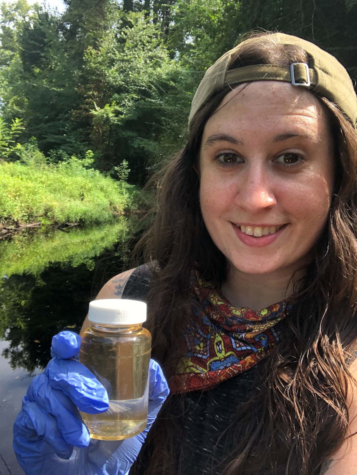 Rebecca Drohan holds a water sample. Photo: Coastal Carolina Riverwatch