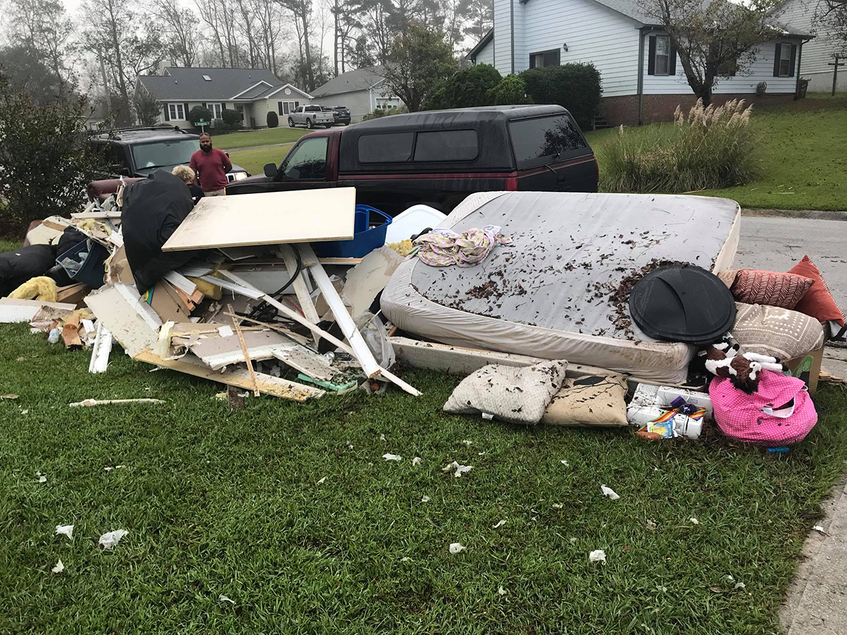 The first pile of debris removed from the Underwood's home following Hurricane Florence awaits pickup on the curb. Photo: Zena Underwood