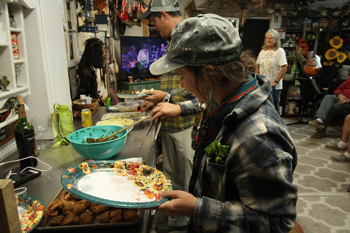 The paddlers partake in a fish fry at Blounts Creek. Photo: Sound Rivers