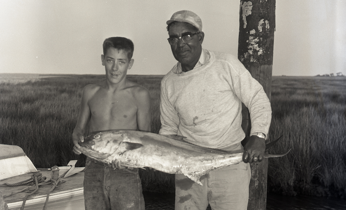 Capt. Joe Berry, right, and longtime mate William K. “Billy” Brown, show off a wahoo in this 1955 photo from the Aycock Brown Papers. Photo: Courtesy of the Outer Banks History Center, State Archives of North Carolina