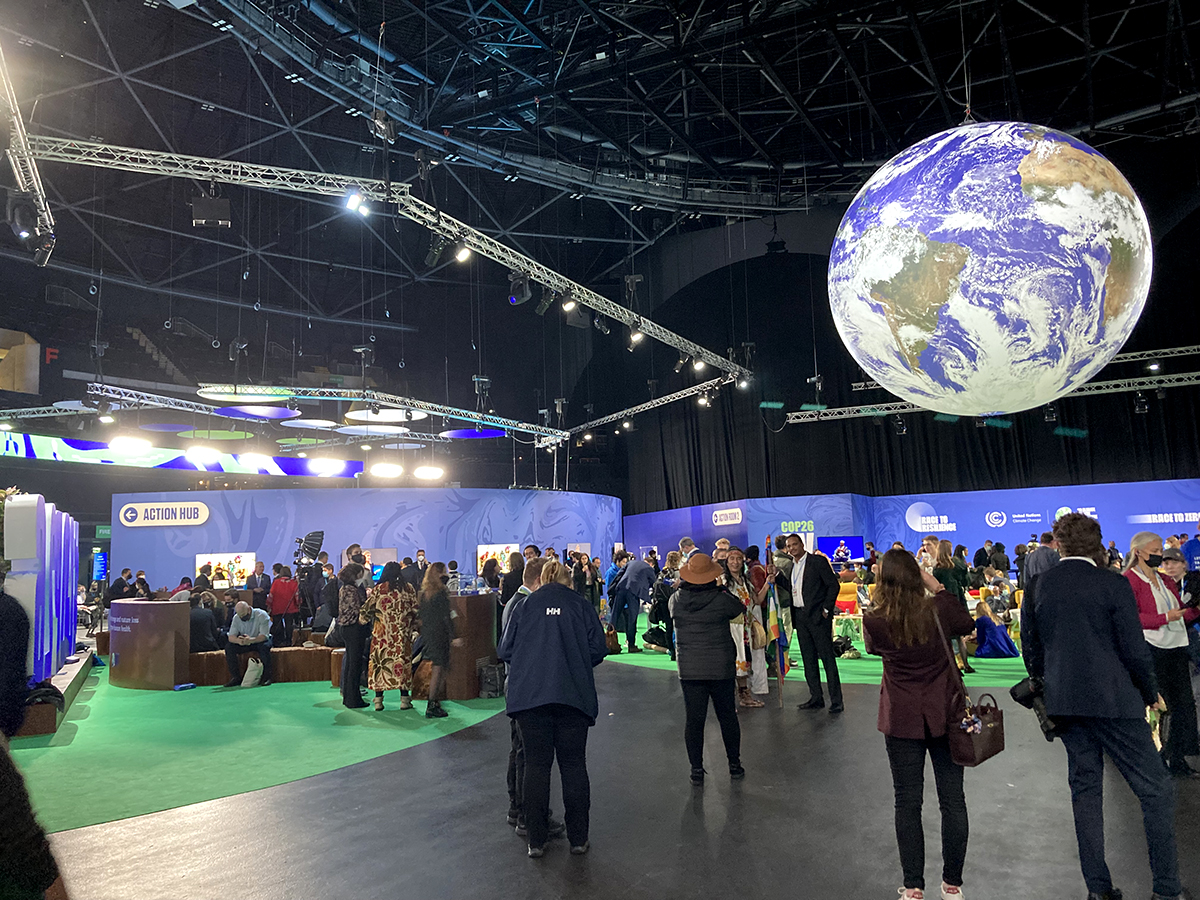 COP26 attendees are shown in the "Action Zone" at the event in Glasgow, Scotland. Photo: Catherine Kozak
