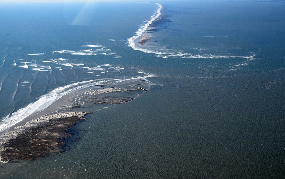 Extreme high tide is shown Monday at Drum Inlet between North Core Banks, left, and South Core Banks. Photo: Mark Hibbs/Southwings