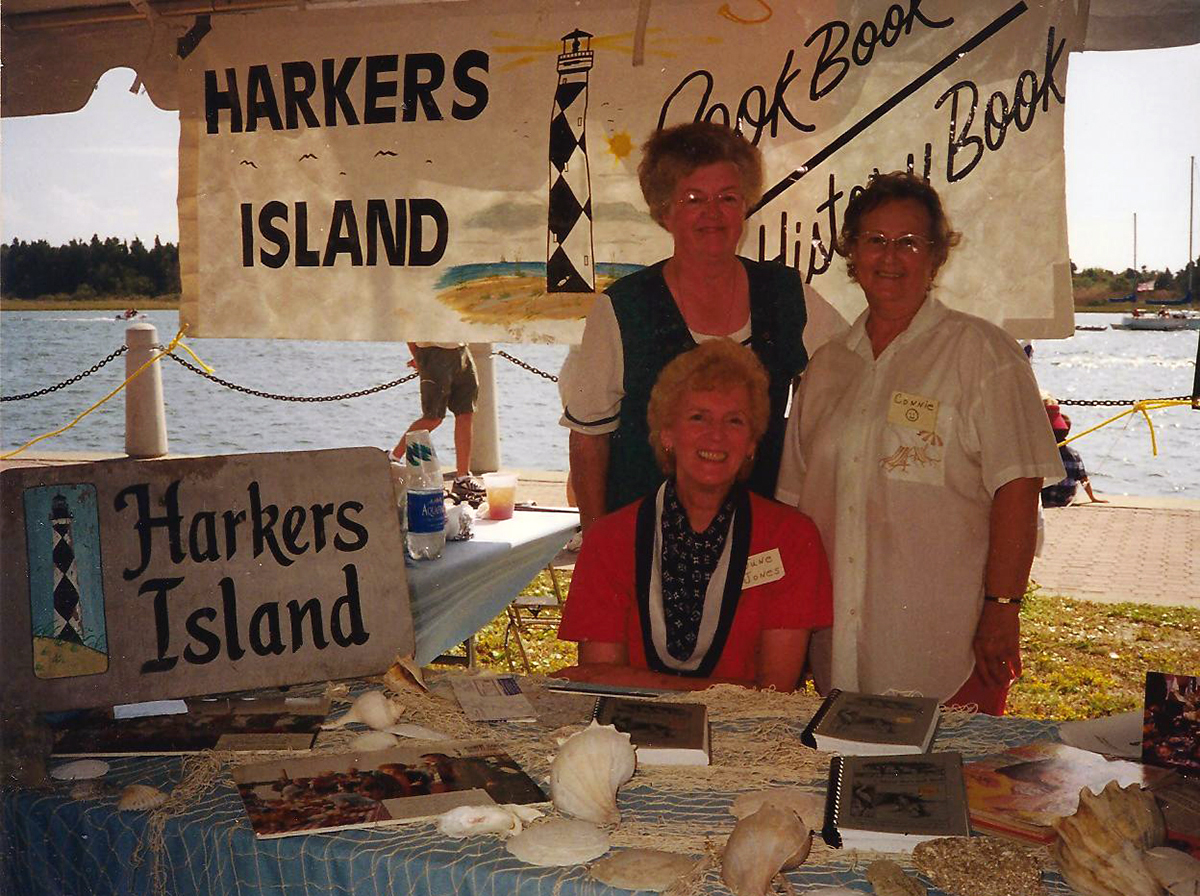 Harkers Island United Methodist Women, including June Jones, seated, Wanda Willis, left, and Connie Gaskill, would travel to shows and festivals to sell “Island Born and Bred.” Proceeds benefited the group’s ministry work. Photo courtesy Karen Willis Amspacher