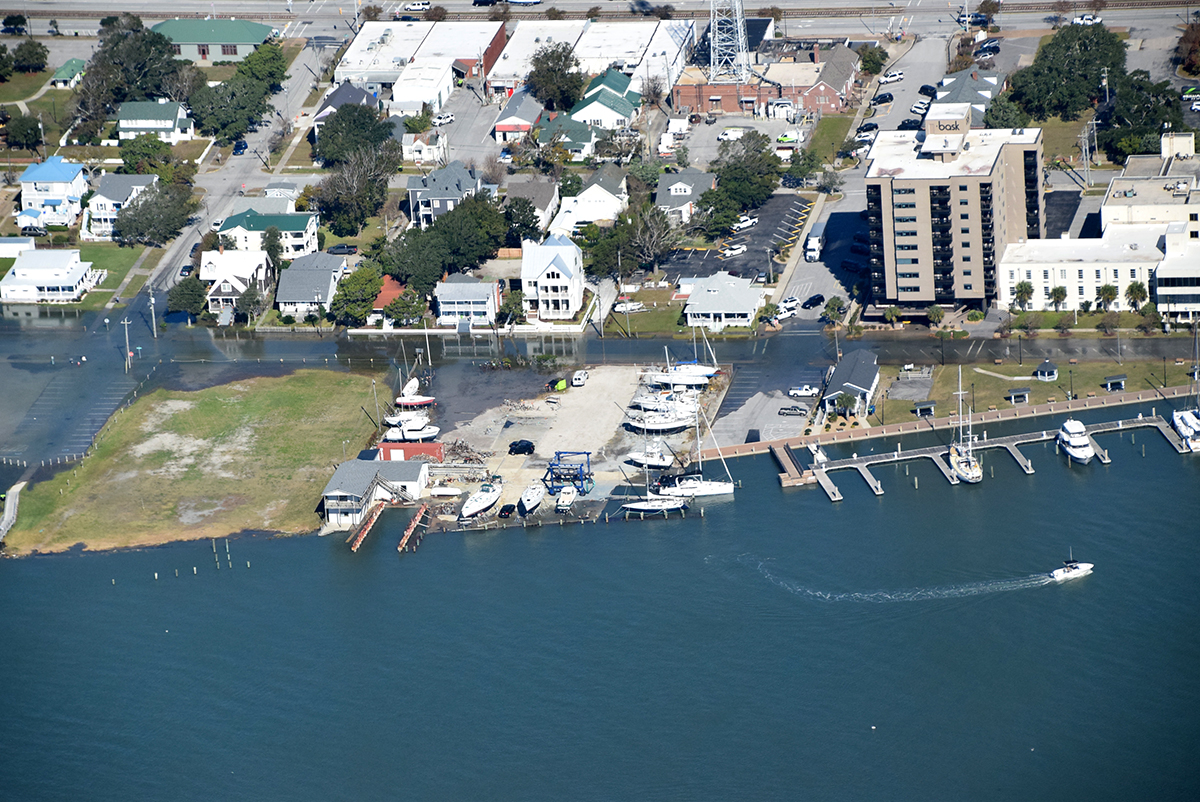 Bogue Sound spills onto Shepard Street and nearby parking lots in Morehead City during a king tide sunny day flood, Nov. 8, 2021. Photo: Mark Hibbs/Southwings