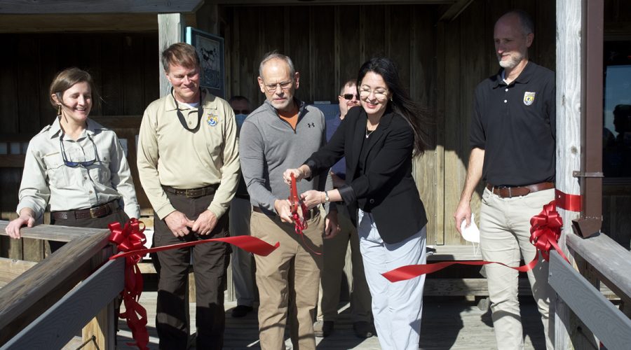 Officials hold a ceremonial ribbon cutting Friday for the renovated and raised Pea Island Visitor Center. Participating are, from left, Coastal N.C. Refuges Complex Project Leader Rebekah Martin, Pea Island and Alligator National Wildlife Refuge Manager Scott Lanier, Pea Island and Alligator National Wildlife Refuge Manager; retired refuge manager Mike Bryant, Interior Department Assistant Secretary for Fish and Wildlife and Parks Shannon Estenoz and U.S. Fish and Wildlife Deputy Regional Director Mike Oetker.