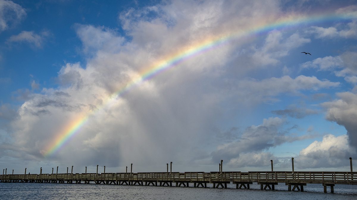 A rainbow commands the sky over the Newport River and the Radio Island Fishing Pier Wednesday in Carteret County. Photo: Dylan Ray