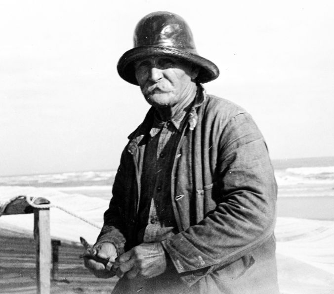 Mullet fisherman Bedford Lawrence, Brown’s Island, N.C., ca. 1937-39. His grandson, Mr. H. B. Lawrence, told me that he lived in Otway, N.C., worshiped at the North River Primitive Baptist Church, played fiddle at community square dances, had “an eye for mullet” and was no stranger to grief. Photo by Charles A. Farrell. Courtesy, State Archives of North Carolina