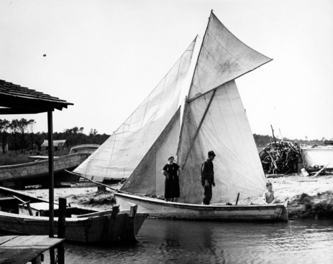 A family getting a lovely little spritsail skiff ready for a trip up the sound, Wanchese, 1937-39. Photo: Charles A. Farrell, courtesy, State Archives of North Carolina 