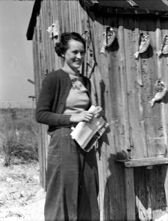 Young Elizabeth Taylor, later Turner visiting a mullet fishermen’s camp on Browns Island in Onslow County,  1939. I met her when she was 99 years old and she recalled the visit in vivid detail. We can see salted spots drying on the cabin wall behind her. Photo: Charles A. Farrell, courtesy, State Archives of North Carolina 